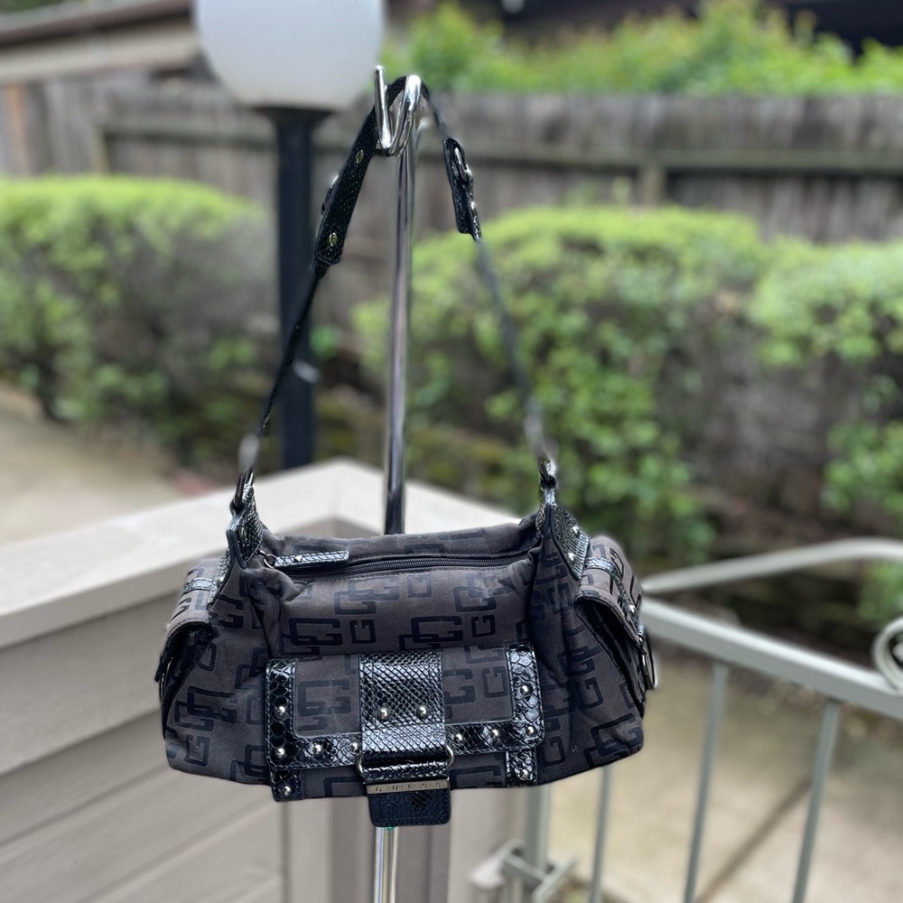 Guess logo studded black shoulder bag. In very good condition.